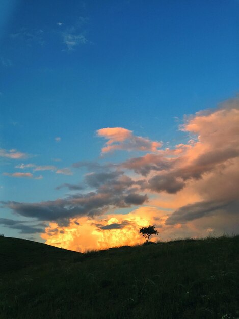 Scenic view of silhouette land against sky during sunset