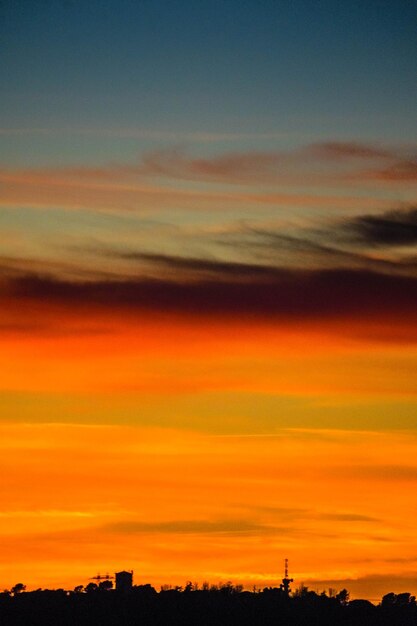 Scenic view of silhouette landscape against romantic sky at sunset