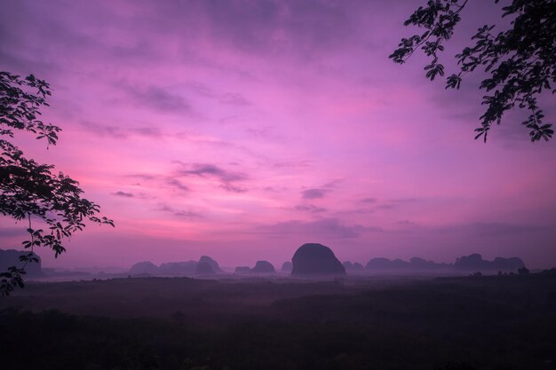 Scenic view of silhouette landscape against romantic sky at sunset