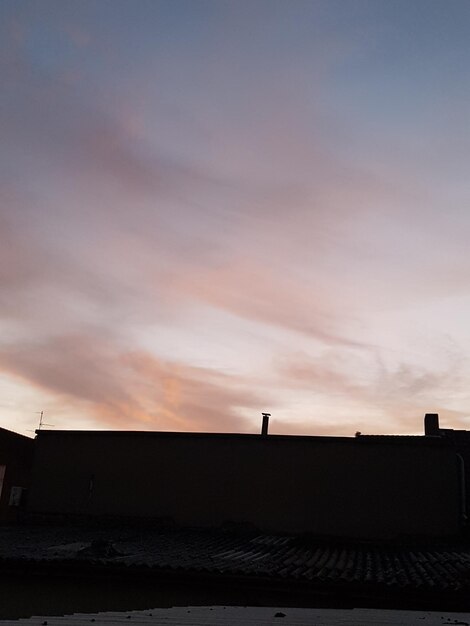 scenic view of silhouette landscape against sky at sunset