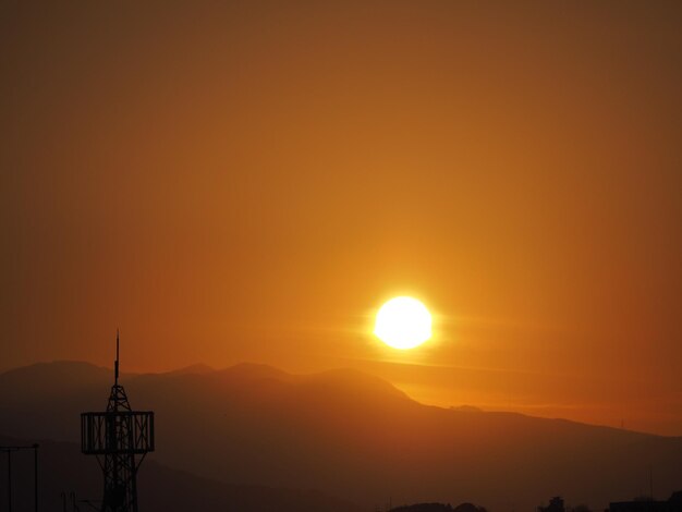 Scenic view of silhouette mountain against romantic sky at sunset