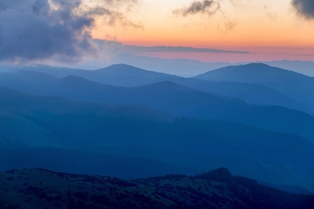 Scenic view of silhouette mountains against sky during sunset