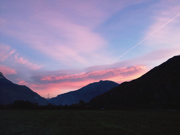 Scenic view of silhouette mountains against sky at sunset