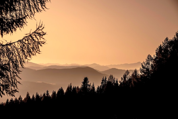 Scenic view of silhouette mountains against sky at sunset