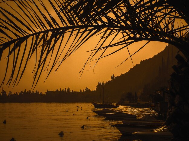 Scenic view of silhouette mountains against sky at sunset