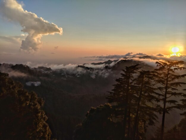 Scenic view of silhouette mountains against sky at sunset