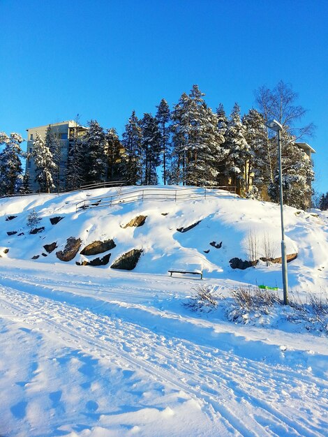 Scenic view of snow covered field against clear sky