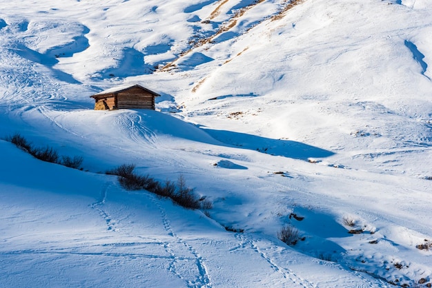 Scenic view of snow covered houses on land