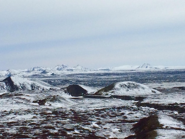 Scenic view of snow covered landscape against sky