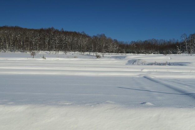 Scenic view of snow covered landscape against sky