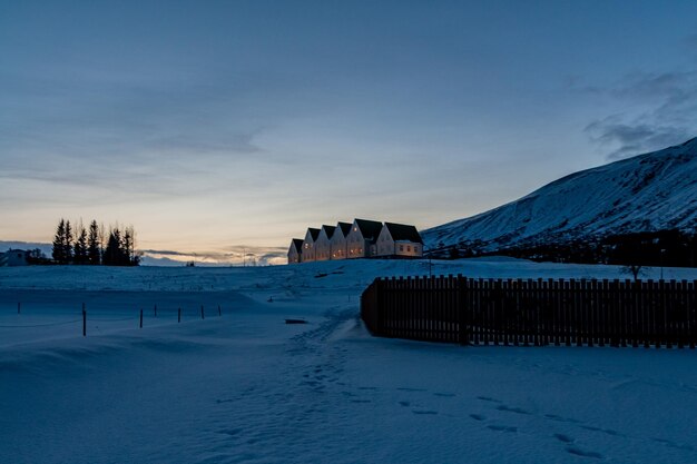 Scenic view of snow covered mountains against sky during sunset