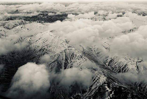 Scenic view of snow covered mountains against sky