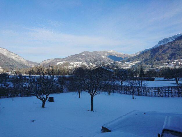 Scenic view of snow covered mountains against sky