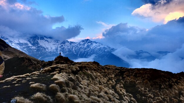 Scenic view of snow covered mountains against sky