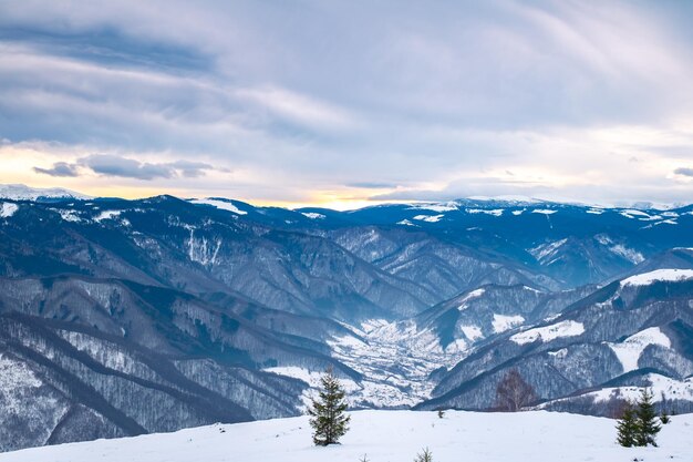 Scenic view of snow covered mountains against sky