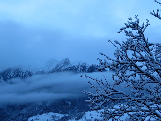 Scenic view of snow covered mountains against sky