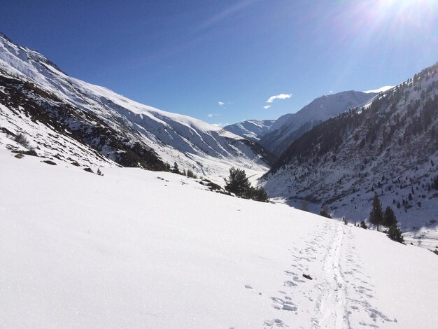 Scenic view of snow mountains against sky