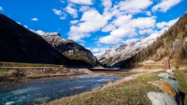 Scenic view of snowcapped mountains against blue sky