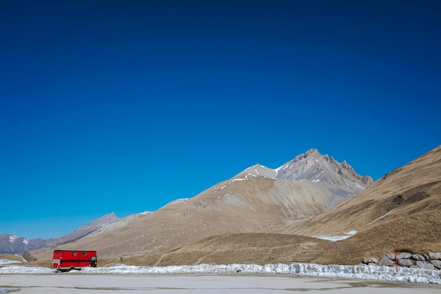 Scenic view of snowcapped mountains against clear blue sky