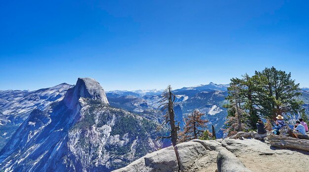 Scenic view of snowcapped mountains against clear blue sky