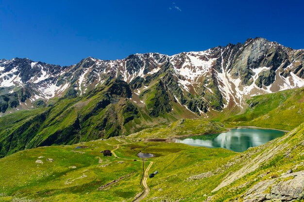 Scenic view of snowcapped mountains against clear sky