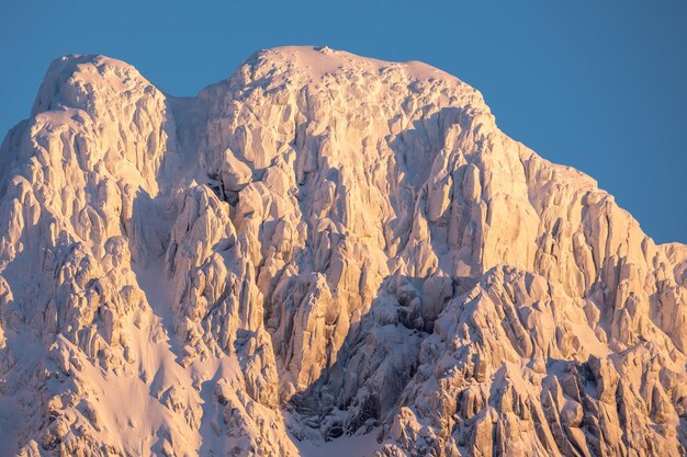 Scenic view of snowcapped mountains against clear sky