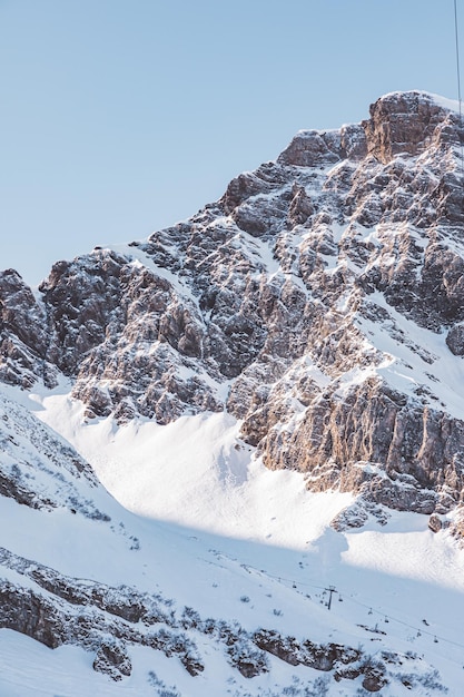 Scenic view of snowcapped mountains against clear sky