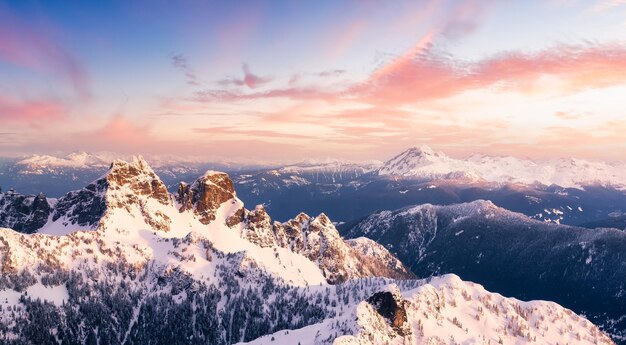 Scenic view of snowcapped mountains against sky during sunset