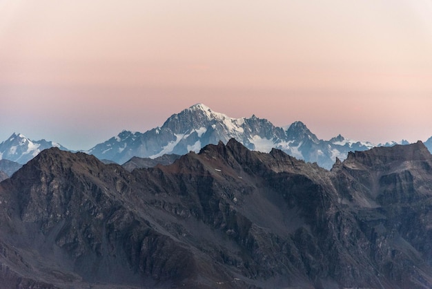 Scenic view of snowcapped mountains against sky during sunset