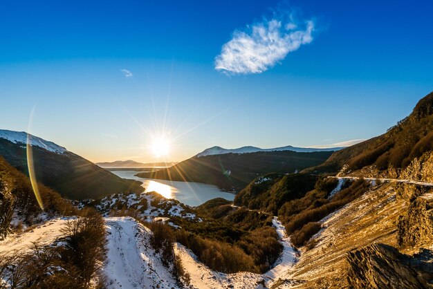 Scenic view of snowcapped mountains against sky during winter