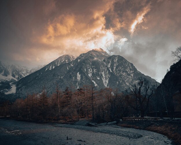 Scenic view of snowcapped mountains against sky during sunrise