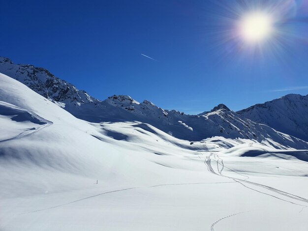 Scenic view of snowcapped mountains against sky