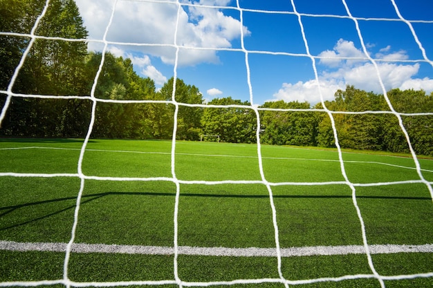 Photo scenic view of soccer field against sky