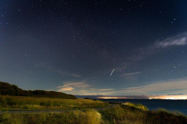 Scenic view of star field against sky at night