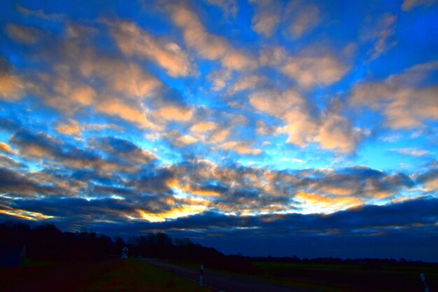 Scenic view of sunset over land