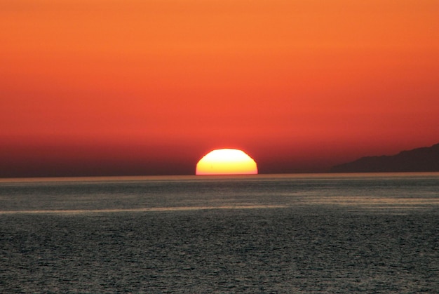 Scenic view of sunset at sea