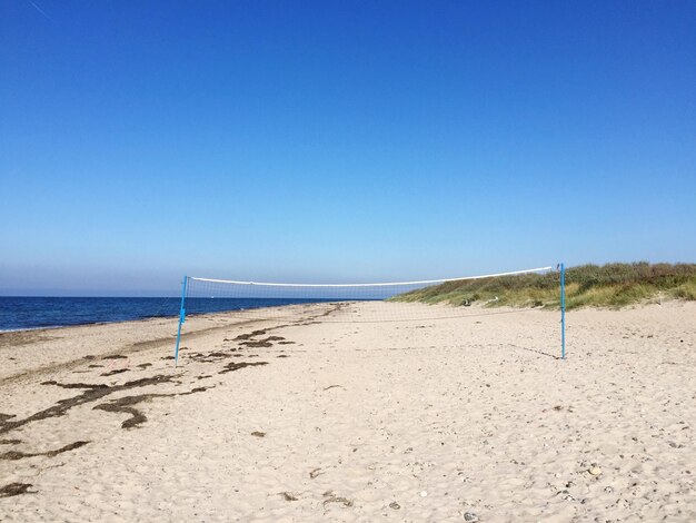 Scenic view of volletyball net on beach