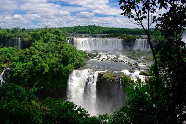 Scenic view of waterfall against sky