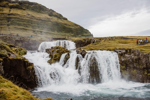 Scenic view of waterfall against sky