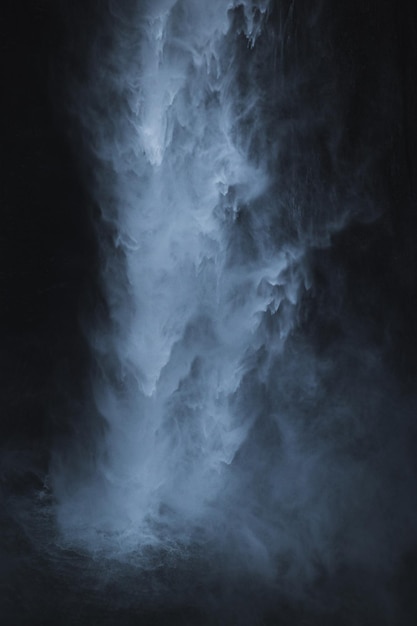 Scenic view of waterfall against sky
