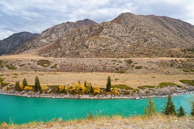 Scenic views of Turquoise Katun river and Altai mountains in autumn