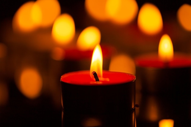 Scented candle,scented candles on old wooden background,symbol\
of eternal memory, mourning, minutes