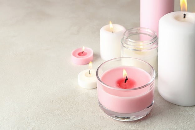 Scented candles for relaxation on white surface