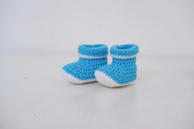 schattige baby haak schoenen als achtergrond