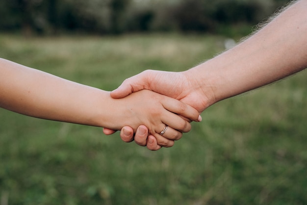 Photo scheme of handshaking and distancing in psychology and the science of body language