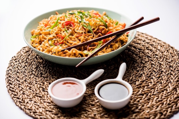 Schezwan veg noodles is a spicy and tasty stir fried flat Hakka noodles with sauce and veggies