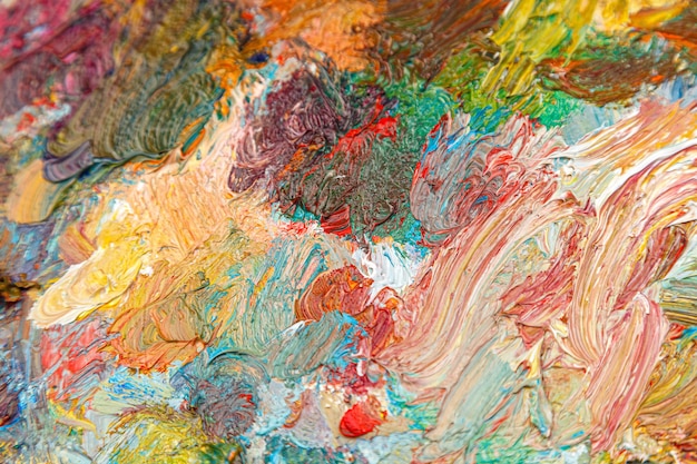Foto schilderpalet met verschillende kleuren van verf closeup