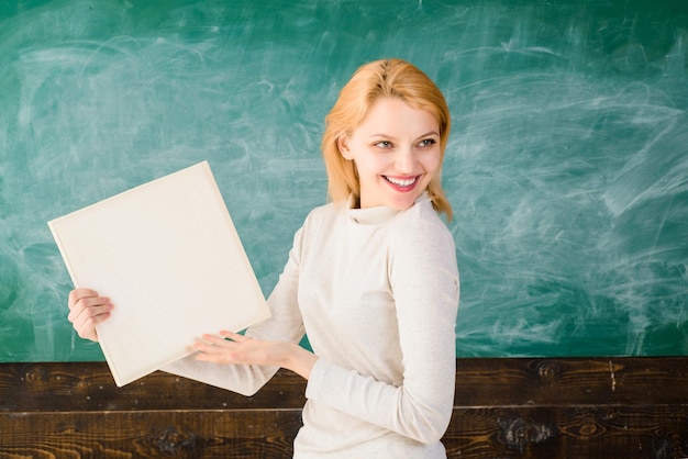 School back to school classroom school teacher education job smiling teacher in classroom holds