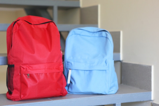 School backpack and stationery in a bright room