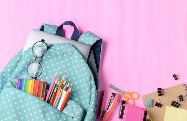 School backpack with color pencil and school supplies 